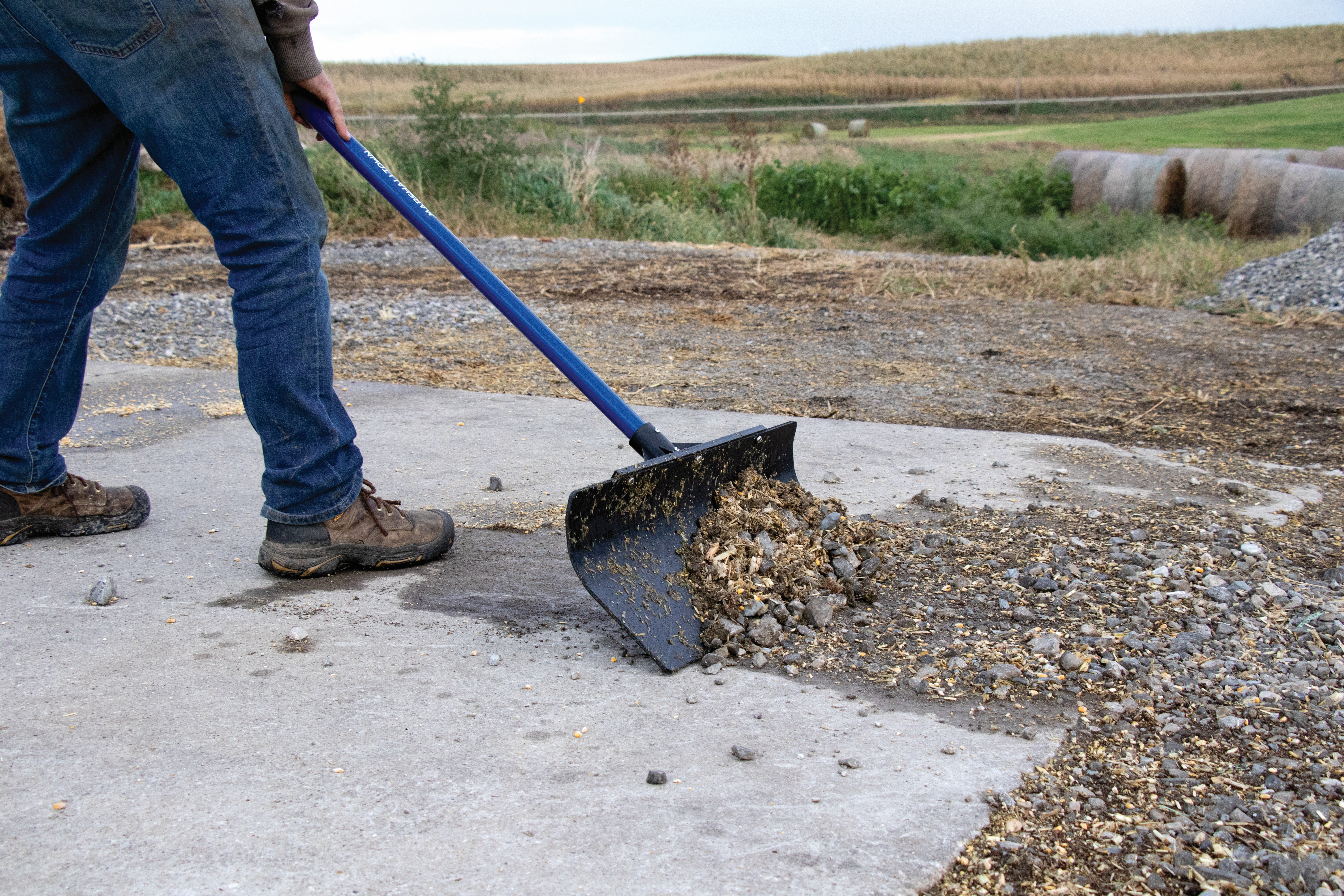 man pushing debris with the polar pusher